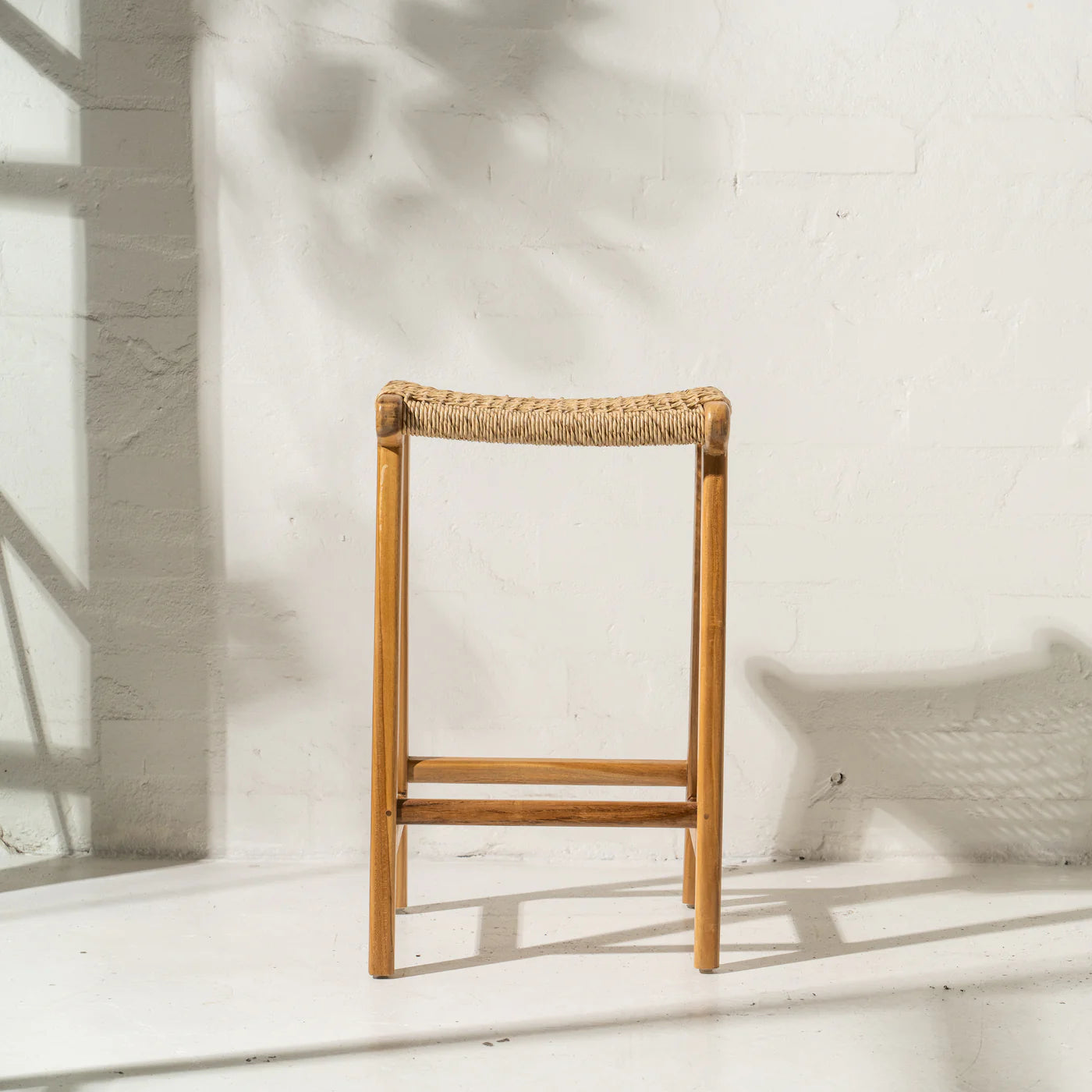 Wooden stool with woven seat